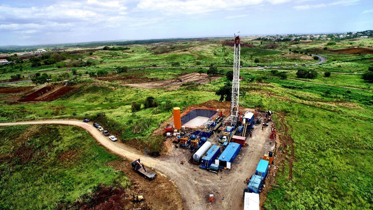 Rig and pad from the air, with trucks on the access road